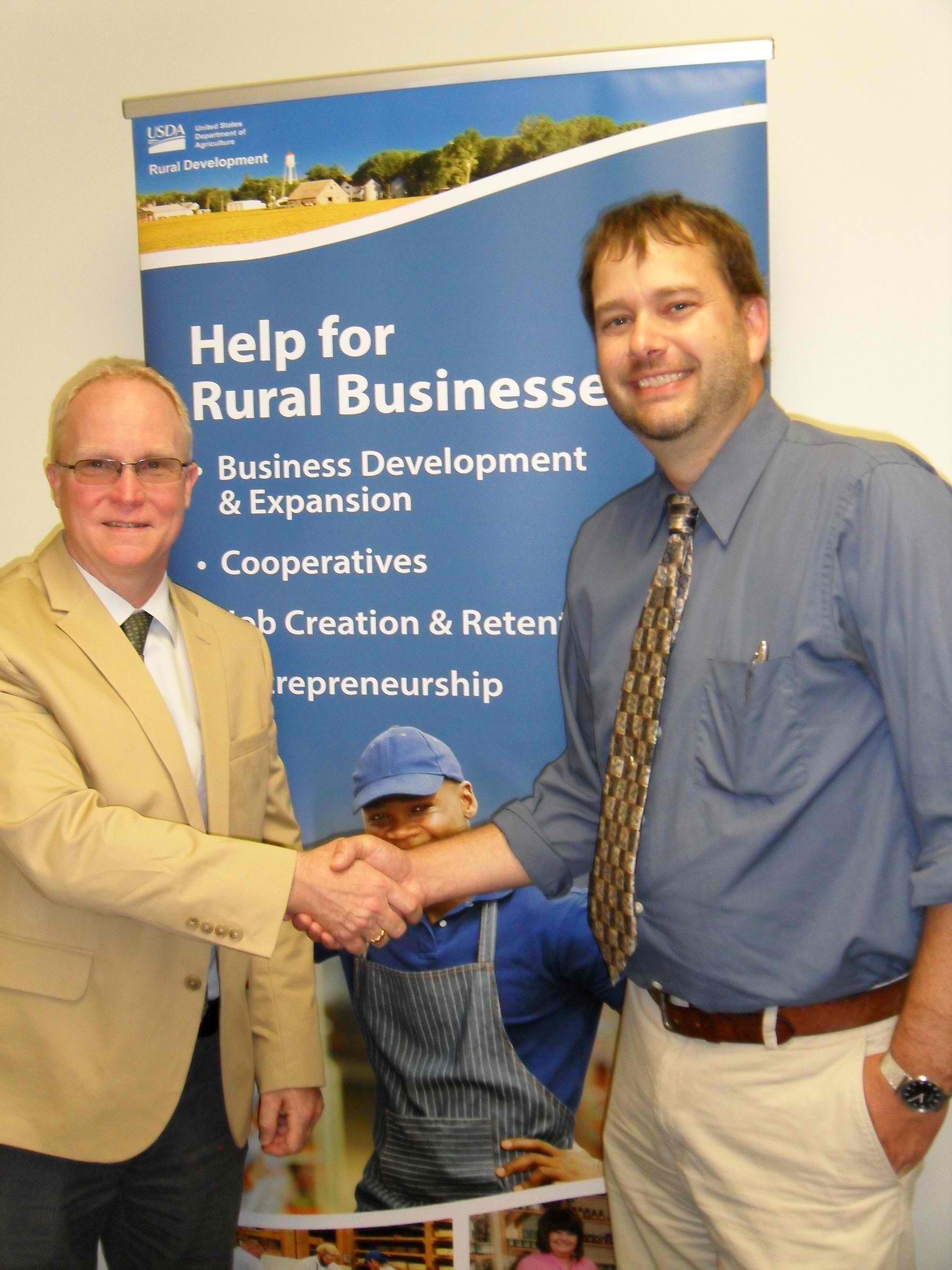 USDA Rural Development Acting State Director Jon-Michael Muise (left) with VCLF Executive Director Will Belongia